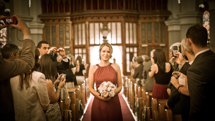 bigger picture photography bridesmaids walking up aisle